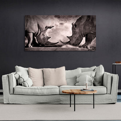 Two rhinos against the sand Canvas Wall Art Print