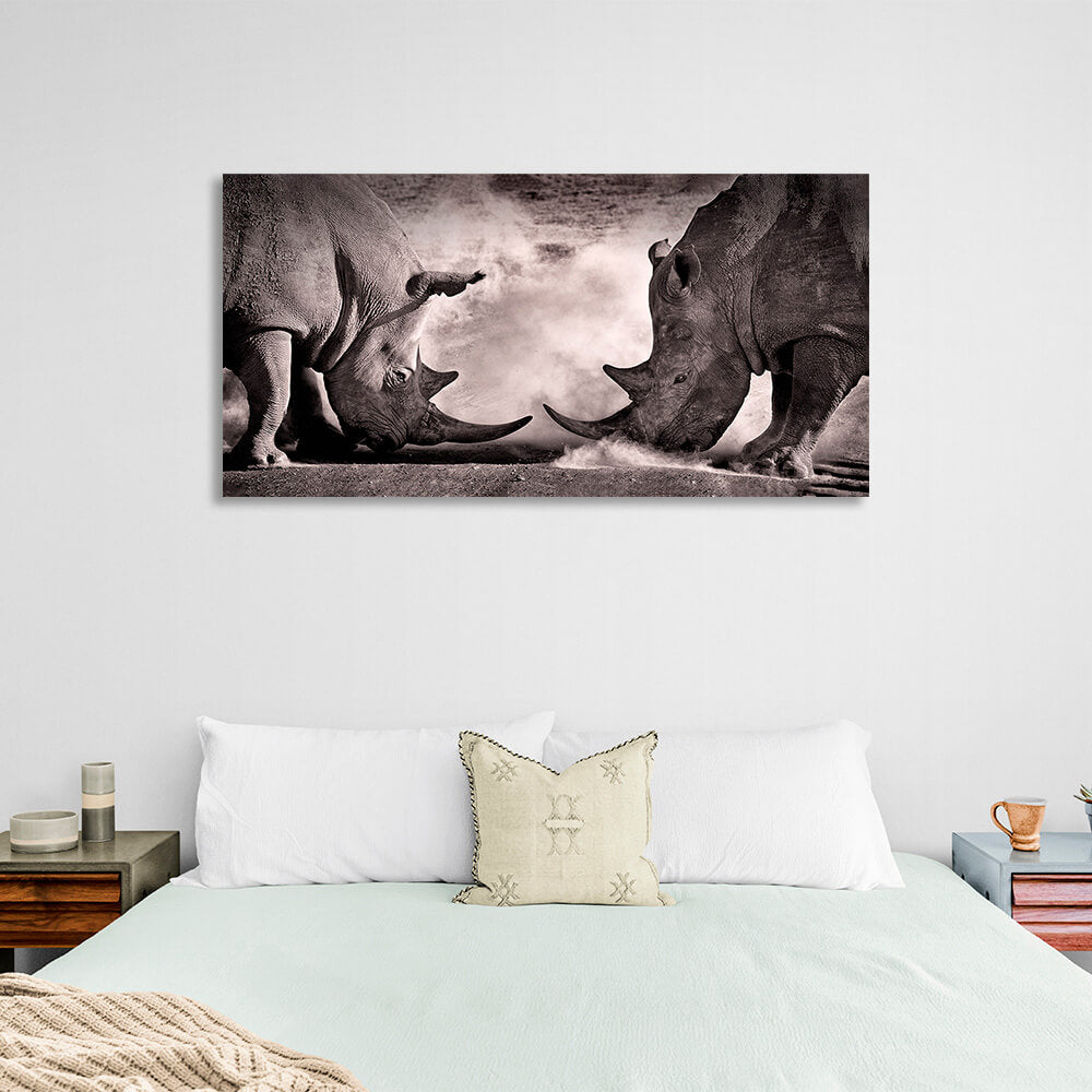 Two rhinos against the sand Canvas Wall Art Print