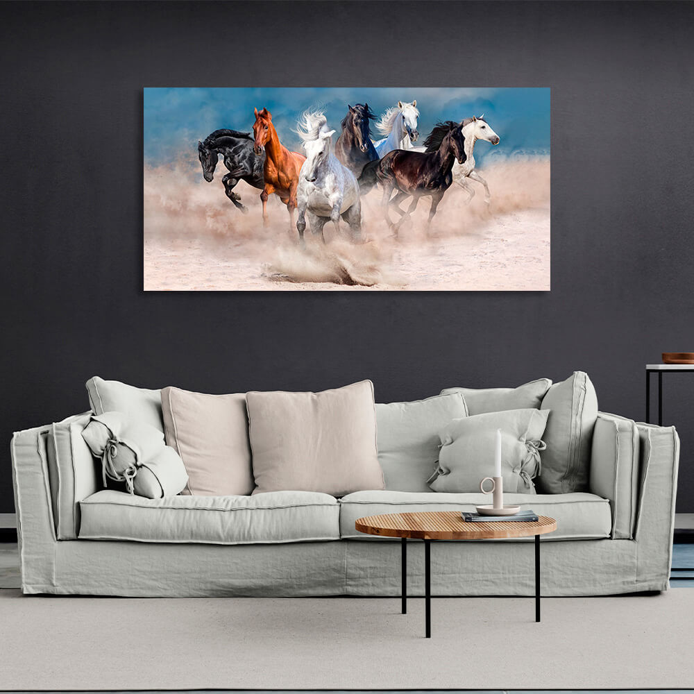 Horizontal picture of 7 horses running through the desert on the background of blue sky Canvas Wall Art Print