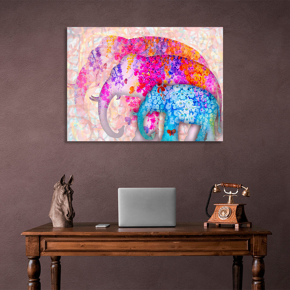 Three elephants of different sizes two of them are drawn in pink colors one in blue colors Canvas Wall Art Print