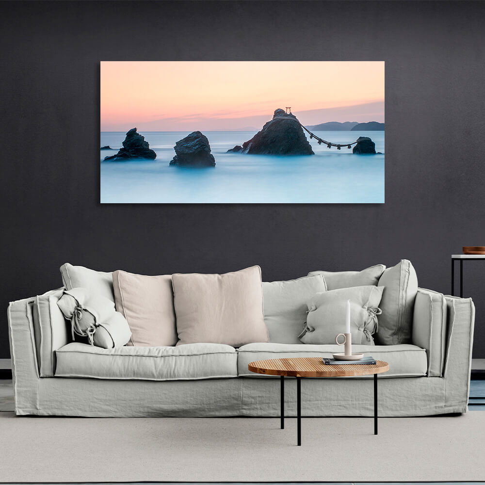 5 rocks in the sea with two mountains in the background Canvas Wall Art Print