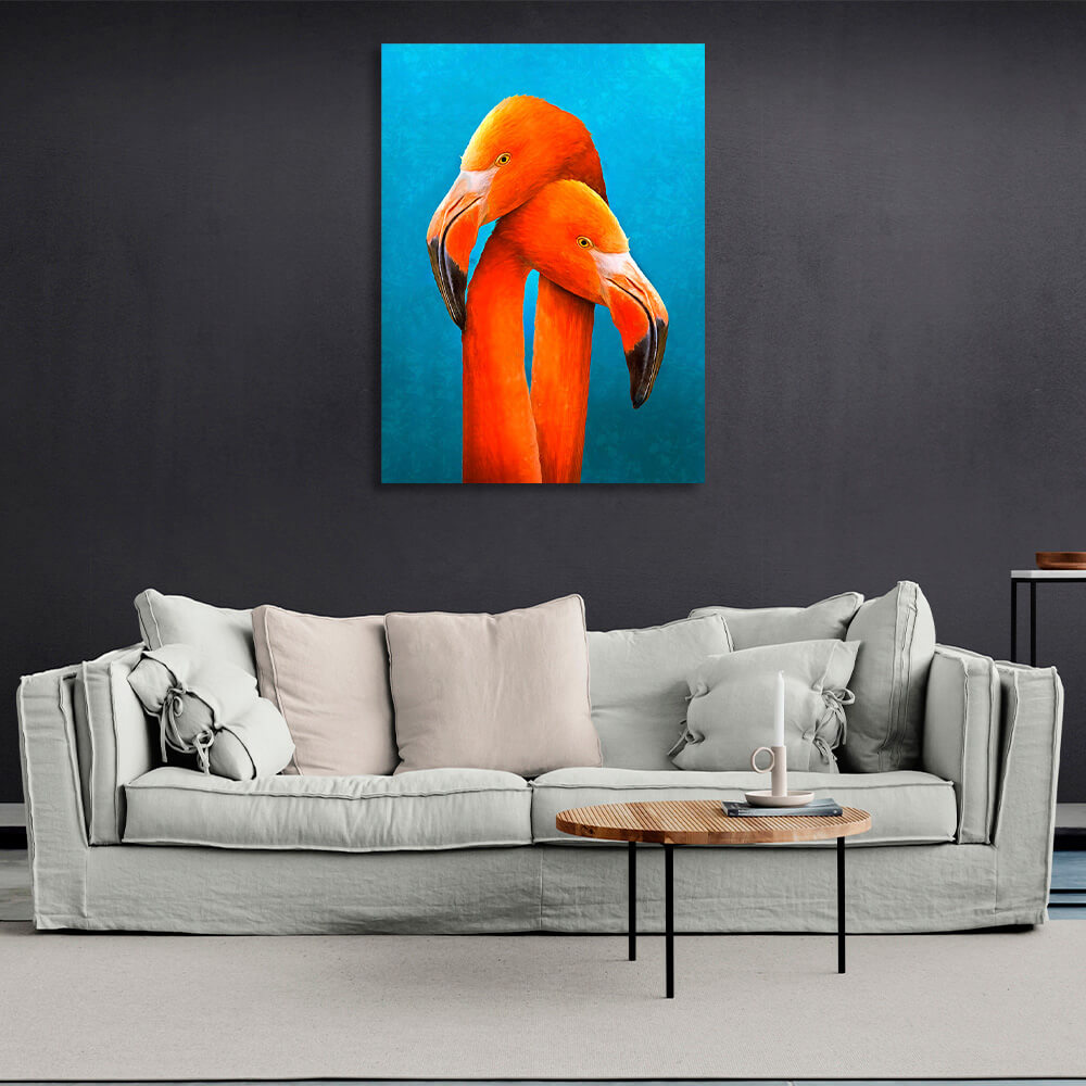 Two orange flamingos on a blue background Canvas Wall Art Print