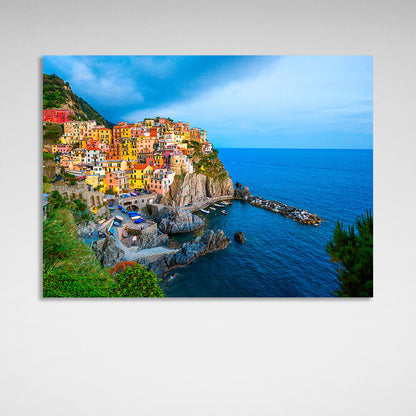 A town with colorful houses near the sea on a cliff Canvas Wall Art Print