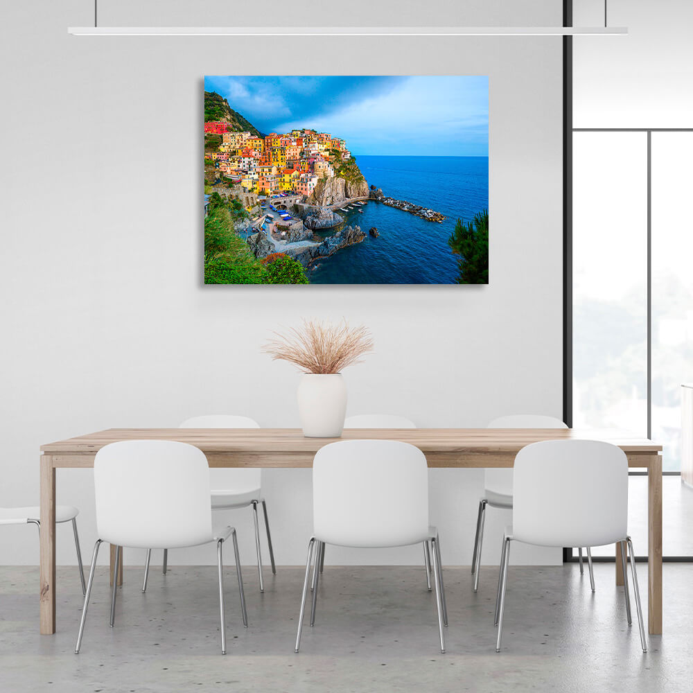 A town with colorful houses near the sea on a cliff Canvas Wall Art Print