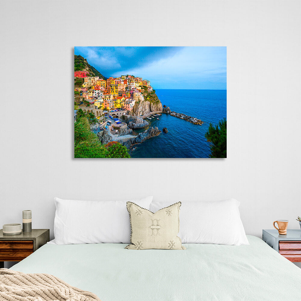 A town with colorful houses near the sea on a cliff Canvas Wall Art Print