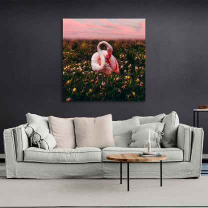 Pink flamingo in a field of flowers background Canvas Wall Art Print