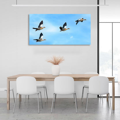 4 birds in a blue sky Canvas Wall Art Print