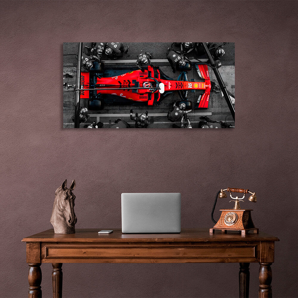 Formula 1 car with people in black suits Canvas Wall Art Print