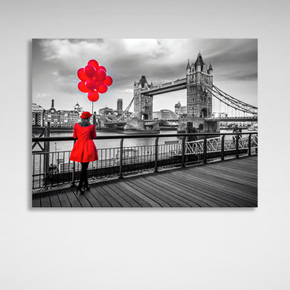 A woman in a red coat and red balloons in the background of London Bridge Canvas Wall Art Print