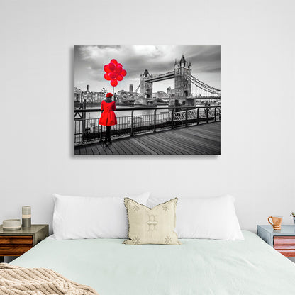 A woman in a red coat and red balloons in the background of London Bridge Canvas Wall Art Print