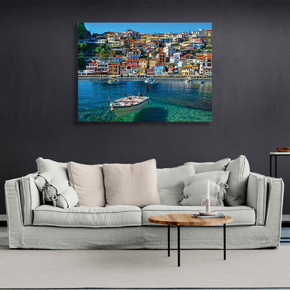 A boat in an incredibly clear sea against the backdrop of a brightly colored city Canvas Wall Art Print