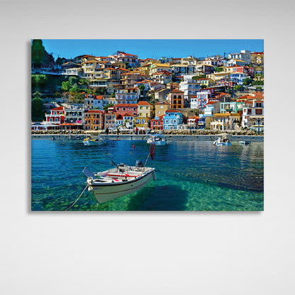 A boat in an incredibly clear sea against the backdrop of a brightly colored city Canvas Wall Art Print