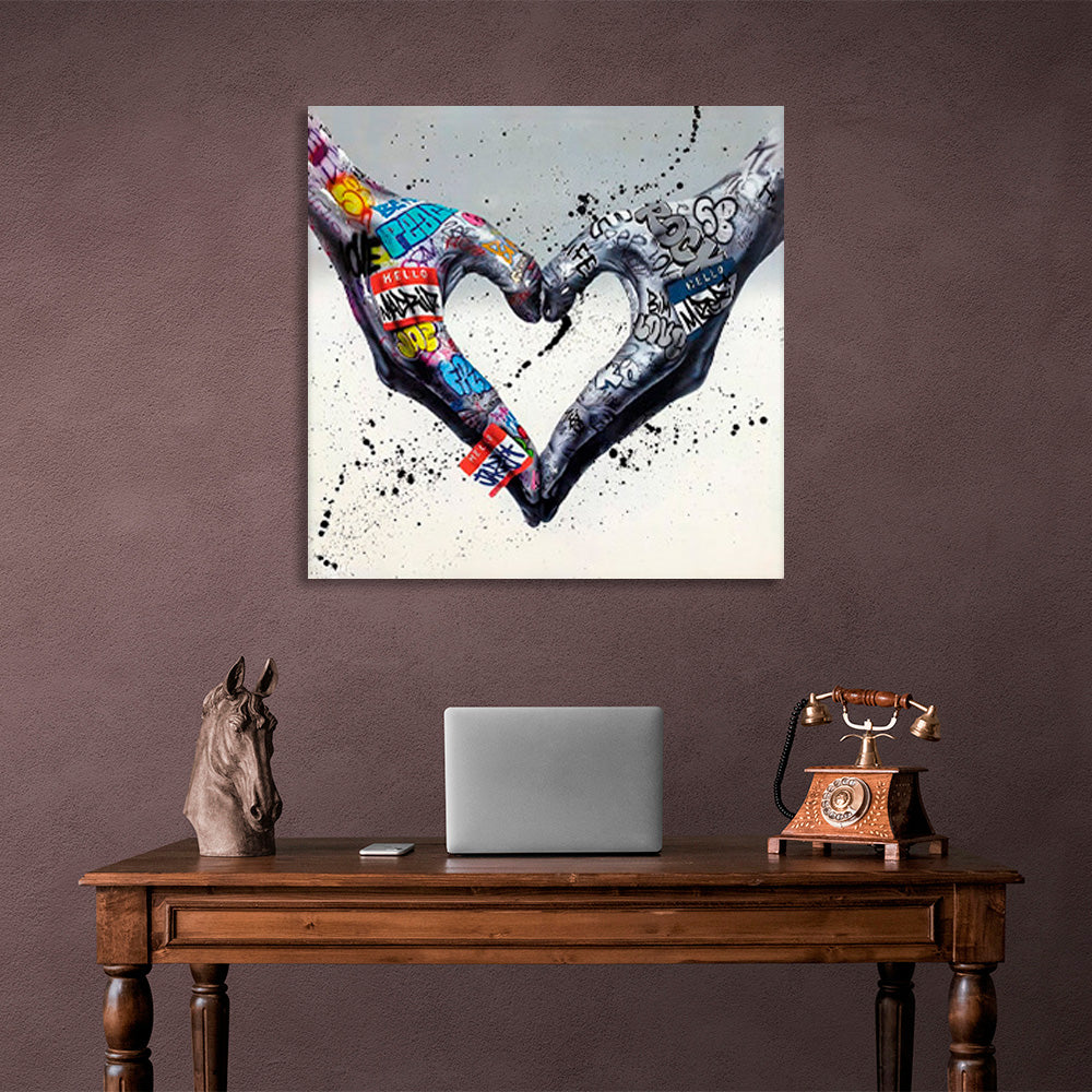 Two hands folded into a heart shape on a gray background in graffiti style Canvas Wall Art Print