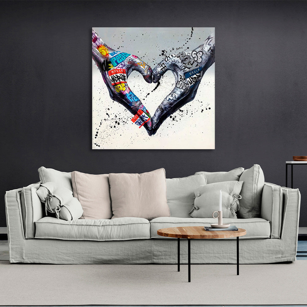 Two hands folded into a heart shape on a gray background in graffiti style Canvas Wall Art Print