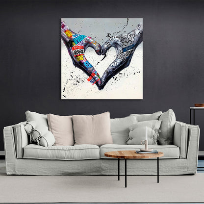 Two hands folded into a heart shape on a gray background in graffiti style Canvas Wall Art Print