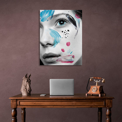 A girl with black eyes with smears of paint on her face Canvas Wall Art Print