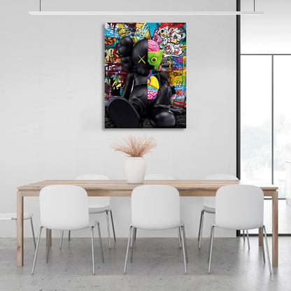 A black doll in the background of graffiti Canvas Wall Art Print