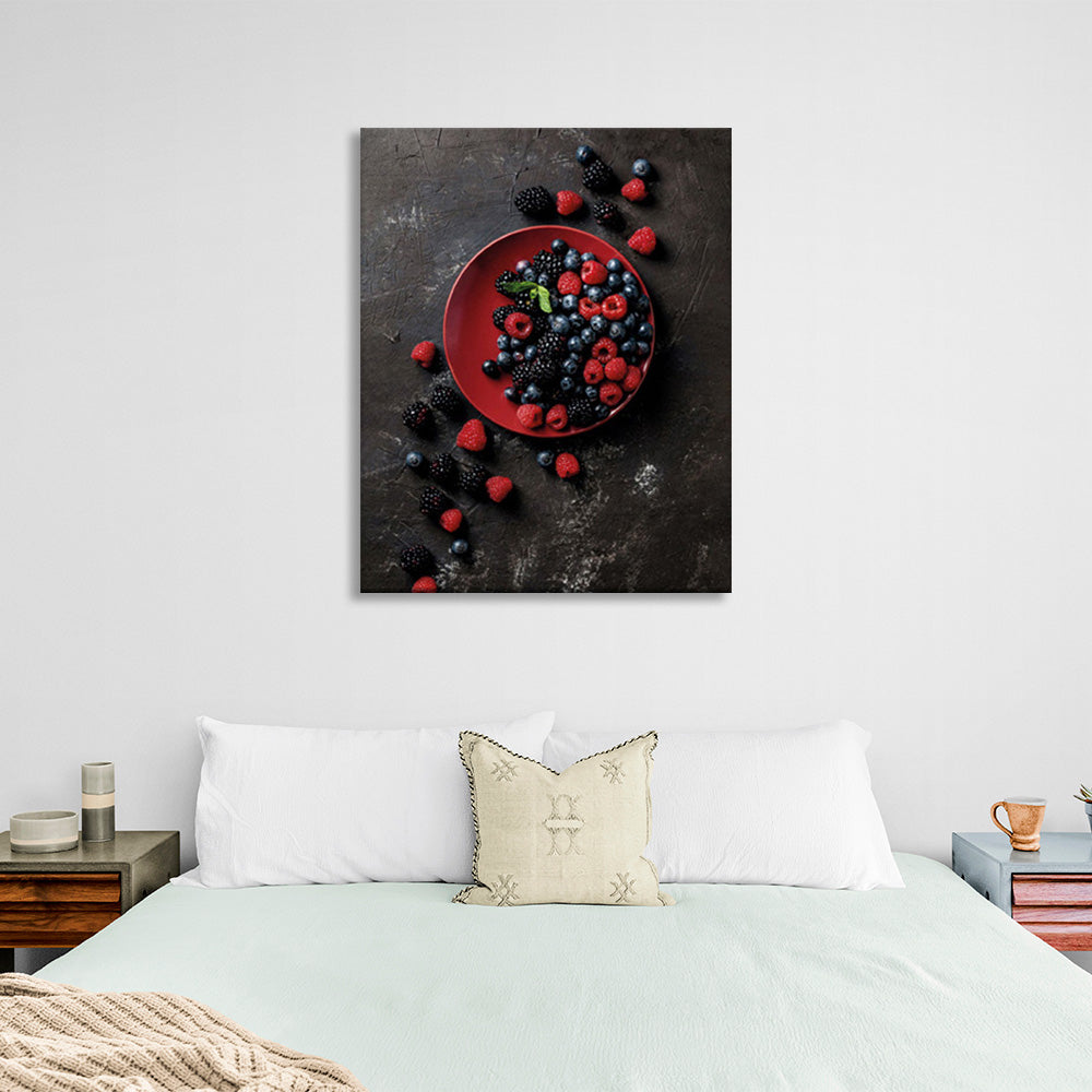 Berries in a red plate on a dark background Canvas Wall Art Print For Kitchen