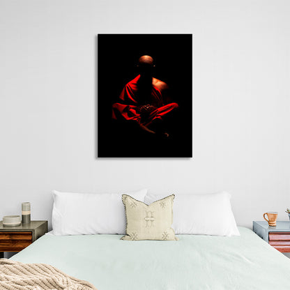 Buddhist monk on black background Canvas Wall Art Print