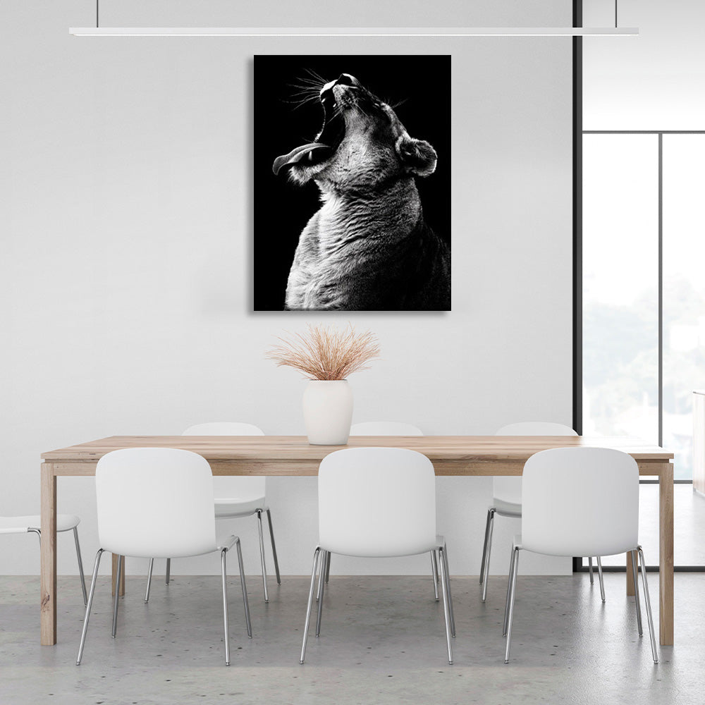 A lioness on a black background Canvas Wall Art Print