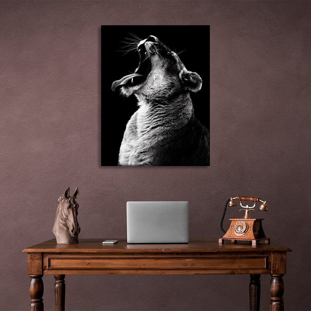 A lioness on a black background Canvas Wall Art Print