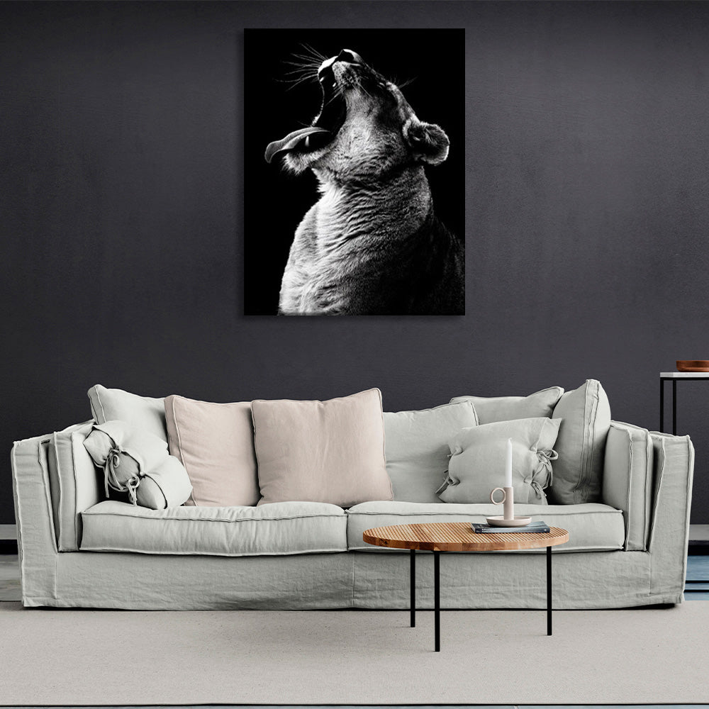 A lioness on a black background Canvas Wall Art Print