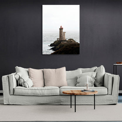 Lighthouse on a rock against the sea Canvas Wall Art Print