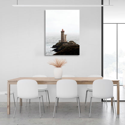 Lighthouse on a rock against the sea Canvas Wall Art Print