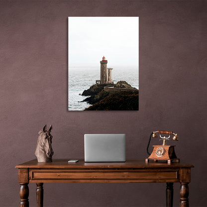 Lighthouse on a rock against the sea Canvas Wall Art Print