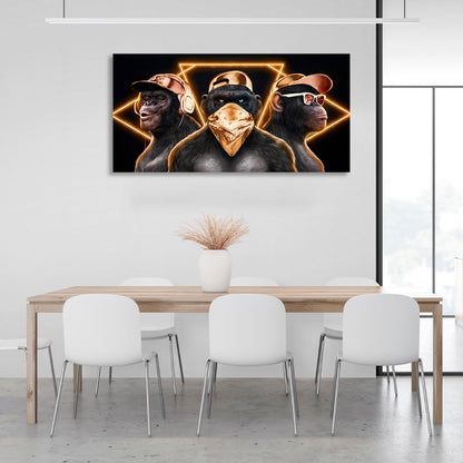 Three monkeys with gold accessories on a black background Canvas Wall Art Print